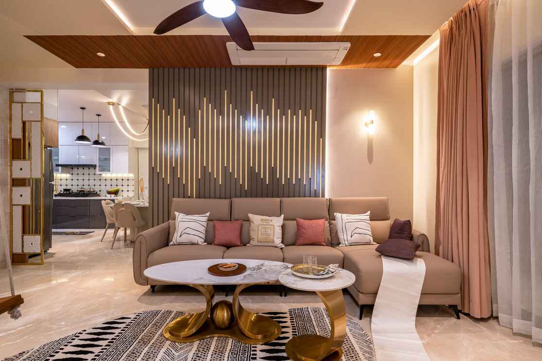 Modern living room interior design featuring ambient lighting, sleek furniture, and gold accents.