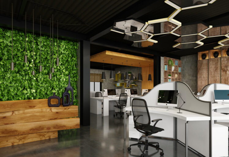 Modern office with green wall, white workstations, black chairs, and geometric lighting
