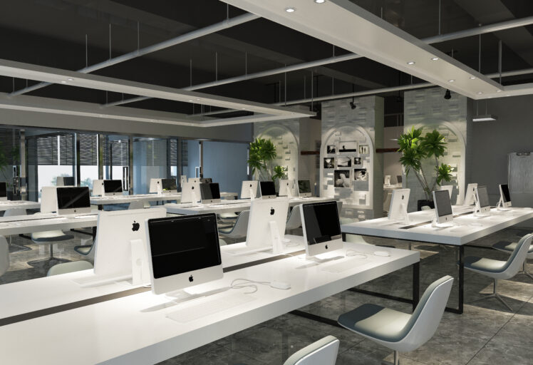 Sleek office interior design with minimalist white workstations, iMacs, and modern decor elements.