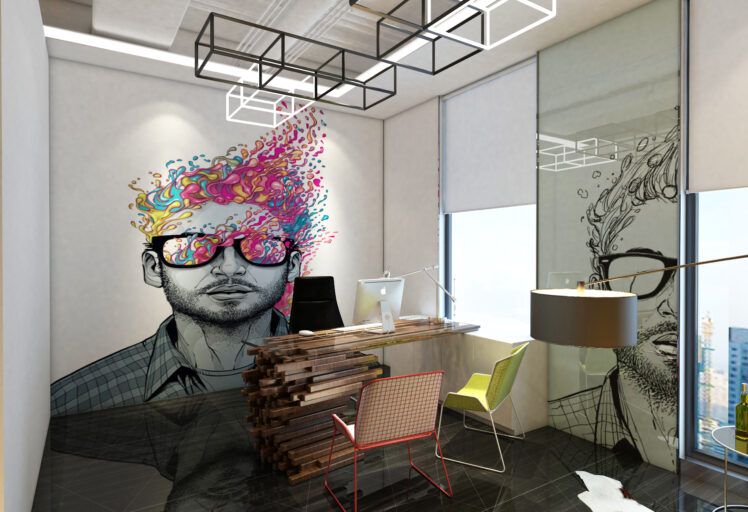 Creative office space with modern furniture and vibrant wall art of a man with colorful hair.