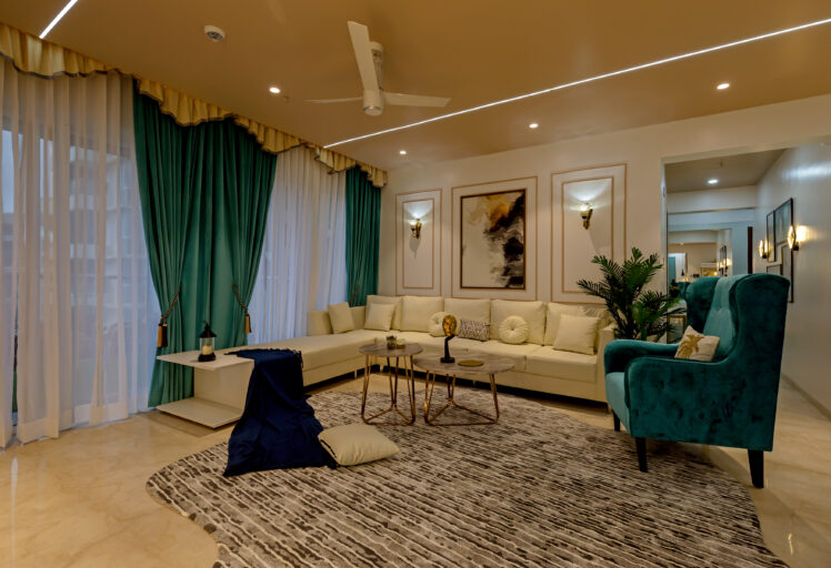 Elegant living room with teal curtains, cream sectional sofa, modern art, and cozy lighting.