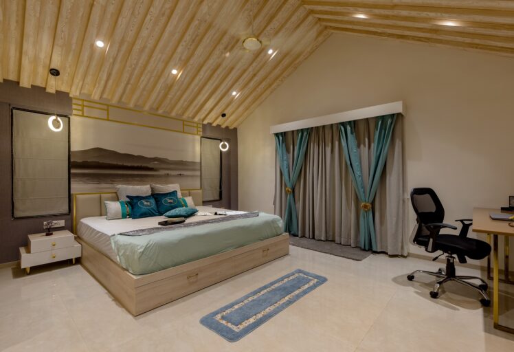 Contemporary open kitchen with white cabinetry, marble backsplash, and stylish pendant lights.