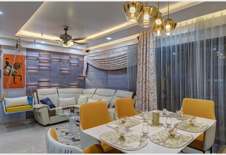 Stylish dining area with wooden table, modern chairs, and minimalist pendant lighting.